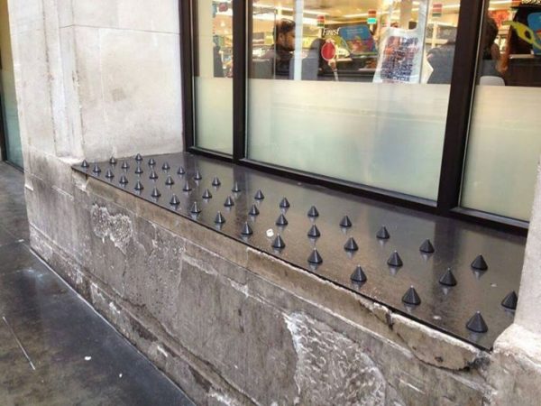 Homeless spikes in storefront window by Kent Williams (CC BY 2.0)